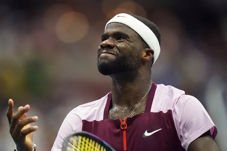 Frances Tiafoe is all smiles after winning a game against Rafael Nadal during the U.S. Open.