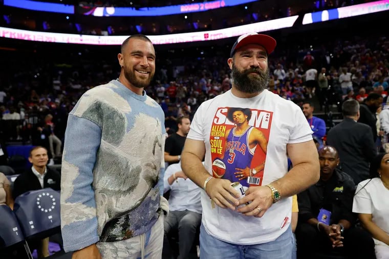 Jason Kelce and Travis Kelce, shown at a Sixers playoff game last year, had rapper and actor Lil Dicky on their "New Heights" podcast.