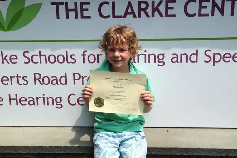 Teddy Linz, 6, one of 16 deaf children who graduated from preschool this month at the Clarke Schools for Hearing and Speech in Bryn Mawr and Philadelphia, with his diploma.
