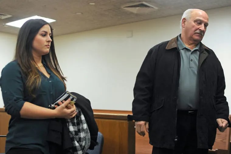 Temple University student Caitlyn Ricci leaves with Grandfather Matthew Ricci after a hearing In a Camden County courtroom December 8, 2014. Riccci sued her separated parents for tuition they don't want to pay. ( TOM GRALISH / Staff Photographer )
