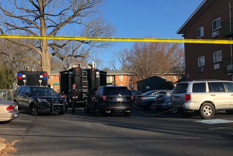 Crime Scene investigators remained Tuesday morning at the apartment complex where five members of a family were found dead on Monday Two other relatives -- a woman and her daughter -- have been charged.