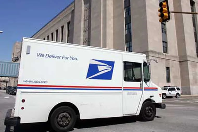 A U.S. Postal Service trucks passes across Chestnut Street. The USPS suffered an almost $3 billion loss in 2008. (David Swanson/Staff File Photo)