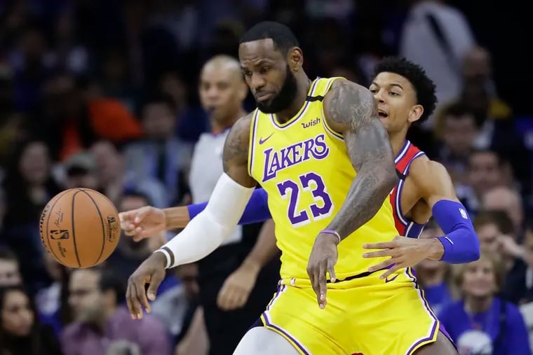 Sixers guard Matisse Thybulle tips the basketball away from Los Angeles Lakers forward LeBron James during their game on Jan. 25.