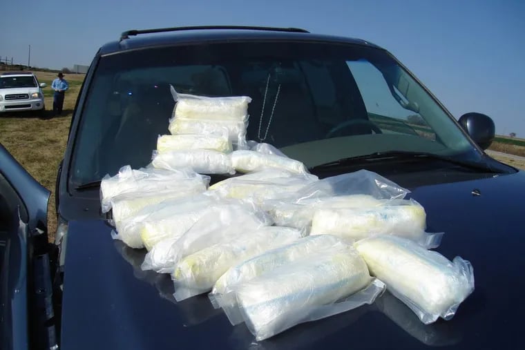 An Oklahoma narcotics agent displays 20 pounds of crystal meth seized from a drug dealer in this file photo from May. The state has seen a rise in syphilis cases driven by the drug epidemic.