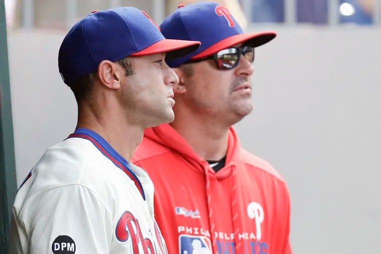Phillies manager Gabe Kapler (left) with pitching coach Chris Young during Sunday's season finale against the Marlins.