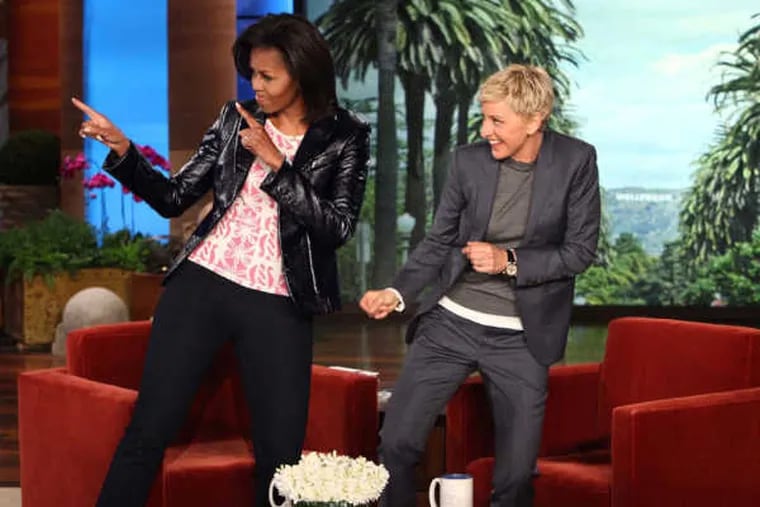 Michelle Obama dancing with Ellen DeGeneres.
