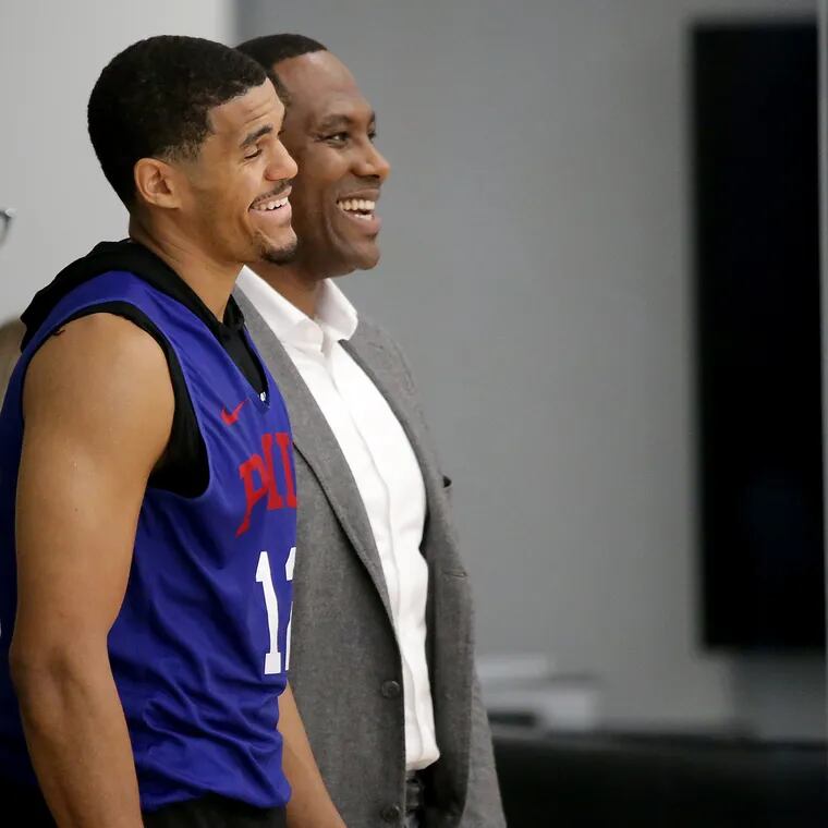 Sixers Tobias Harris, left, and general manager Elton Brand, right, laugh during Sixers practice in Camden, NJ on October 3, 2019.