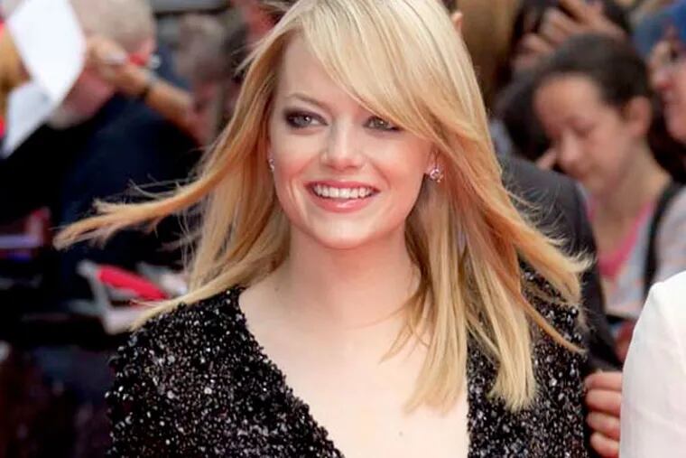 US actress Emma Stone arrives for the UK premiere of The Amazing Spider-Man at a central London cinema, Monday, June 18, 2012. (AP Photo/Joel Ryan)