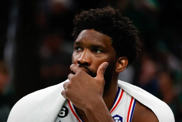 Sixers center Joel Embiid watches his teammates on the court during the fourth quarter against the Boston Celtics in Game 2 of the Eastern Conference semifinal playoffs at TD Garden in Boston on Wednesday, May 3, 2023.