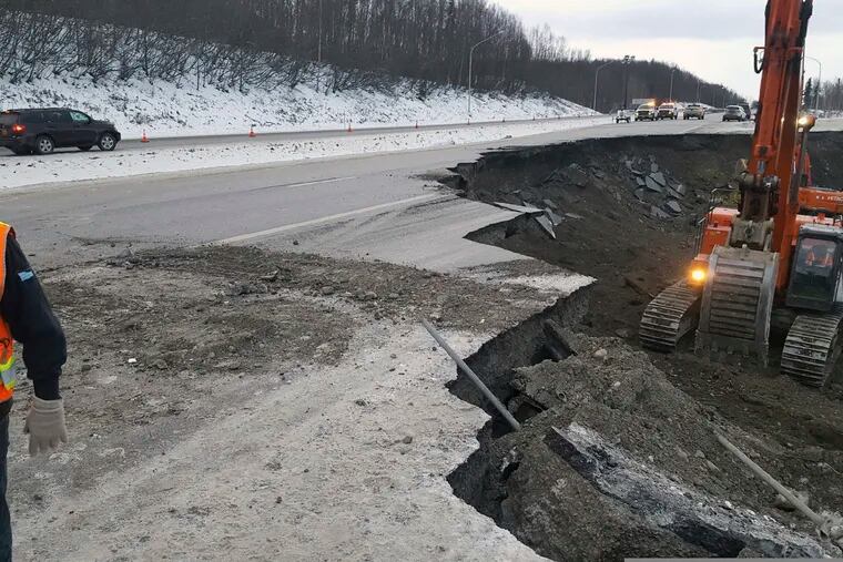 This photo provided by Chris Riekena shows excavation work being conducted Saturday, Dec. 1, 2018, near the Mirror Lake exit of the Glenn Highway near Eklutna, Alaska, to make the highway ready for repaving. The highway was heavily damaged in several spots following a magnitude 7.0 earthquake on Nov. 30, 2018. (Chris Riekena via AP)