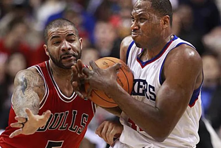 Sixers forward Elton Brand gets fouled by Bulls forward Carlos Boozer in the first quarter of Game 3. (Ron Cortes/Staff Photographer)