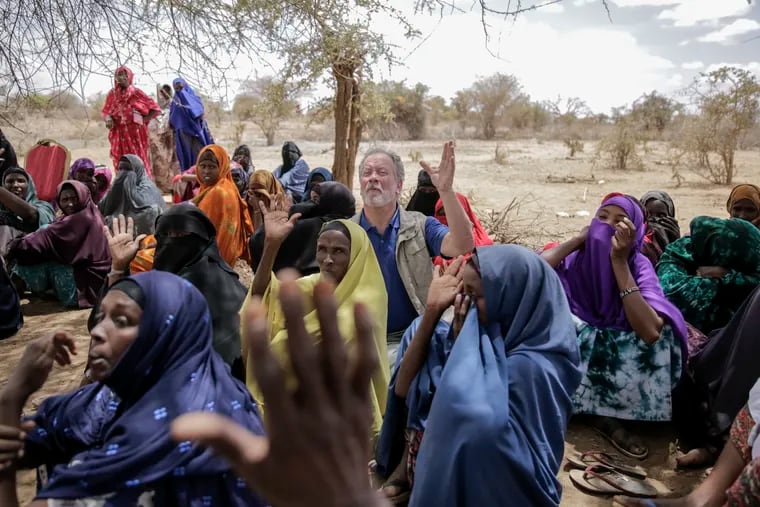 World Food Program chief David Beasley meets with villagers in the village of Wagalla in northern Kenya Friday, Aug. 19, 2022. The United States is stepping up to buy about 150,000 metric tons of grain from Ukraine in the next few weeks for an upcoming shipment of food aid from ports no longer blockaded by war, the World Food Program chief has told The Associated Press.