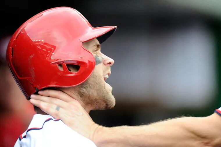 ASSOCIATED PRESS Bryce Harper is choked by teammate Jonathan Papelbon in the bottom of the eighth inning.