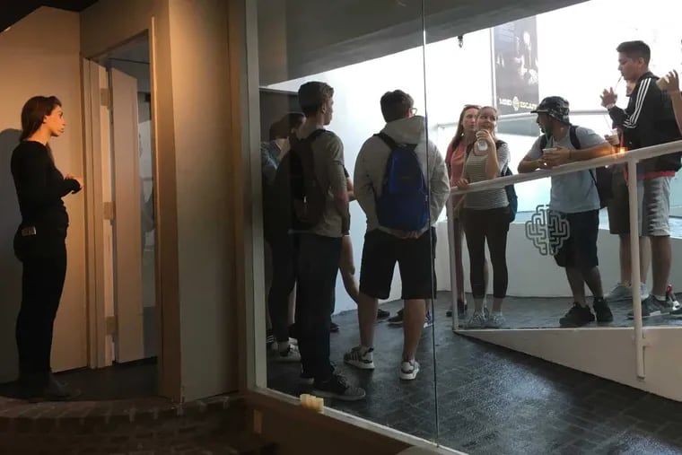 Mindescape co-founder Vered Bakshtein greets high school seniors from Montreal at her new escape room on 4th Street near South.