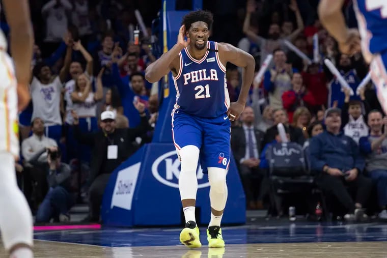 Joel Embiid reacts after scoring 49 points against the Atlanta Hawks at the Wells Fargo Center.