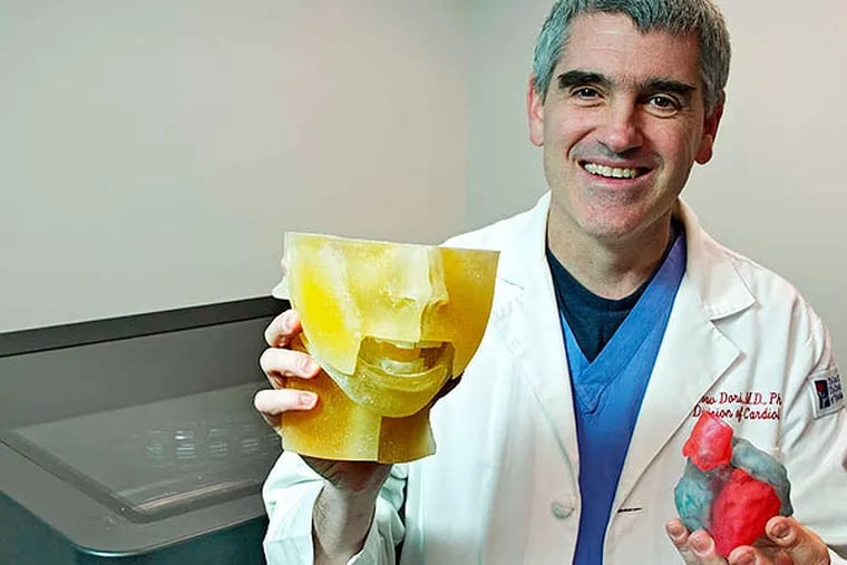 Cardiologist Yoav Dori with printed models. &quot;The malformations that we deal with are incredibly complex,&quot; he says.