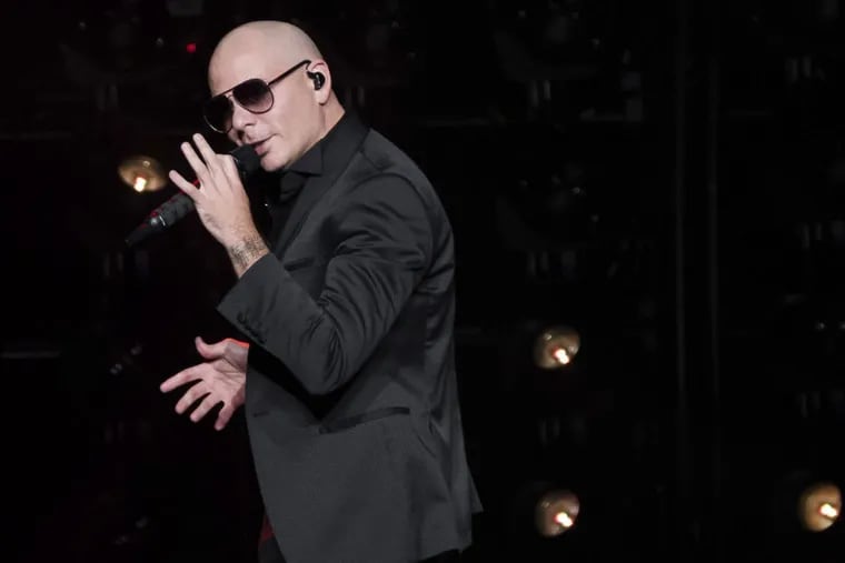 FILE – In this June 30, 2017, file photo, Pitbull performs in concert at Madison Square Garden in New York.