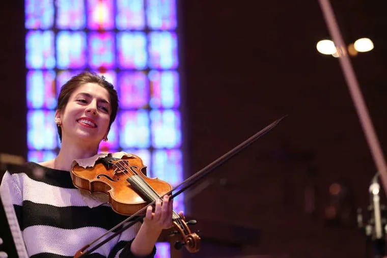 The violinist Alana Youssefian plays Monday during a recording session at St. Rose of Lima, her childhood church in Haddon Heights.