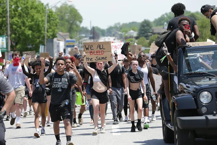 The Main Line for Black Lives protest marches down Lancaster Avenue in Paoli, Pa. on June 4, 2020. The group marched from the Wayne Train Station to the Paoli Train Station.