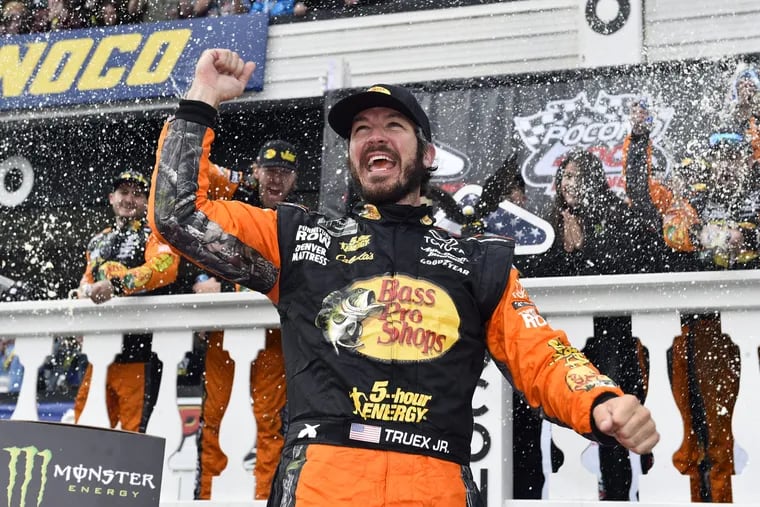 Martin Truex Jr. celebrates in Victory Lane after winning the Pocono 400 on Sunday in Long Pond, Pa. 