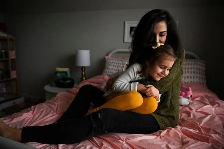 Logan Andreotta and daughter Bonnie Andreotta, 4, at home in Bowling Green, Ky. Although only 24 and healthy when she started in vitro fertilization, Andreotta suffered a painful bout of ovarian hyperstimulation syndrome.