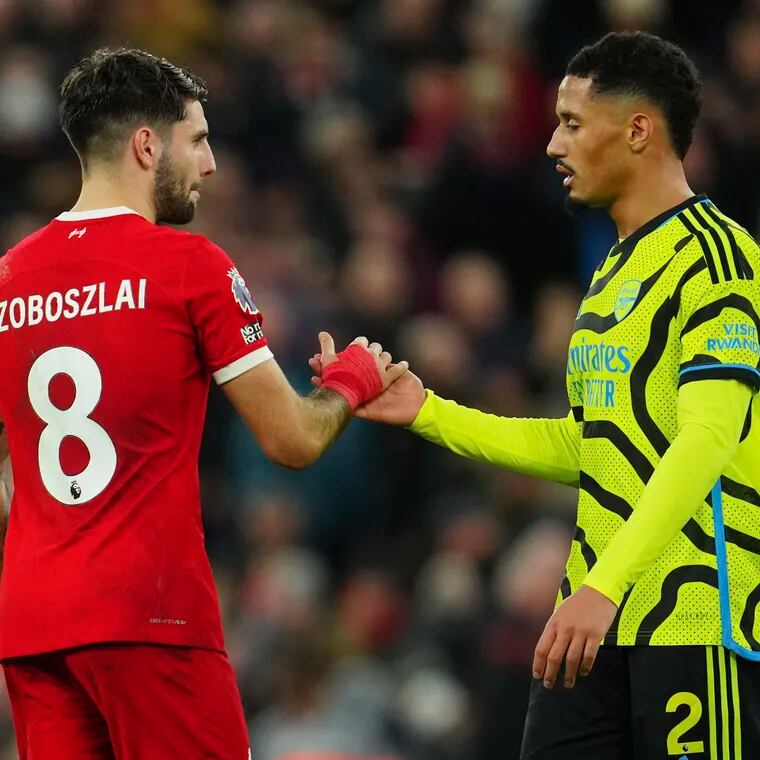 Liverpool's Dominik Szoboszlai (left) and Arsenal's William Saliba (right) shake hands after they faced off last December.