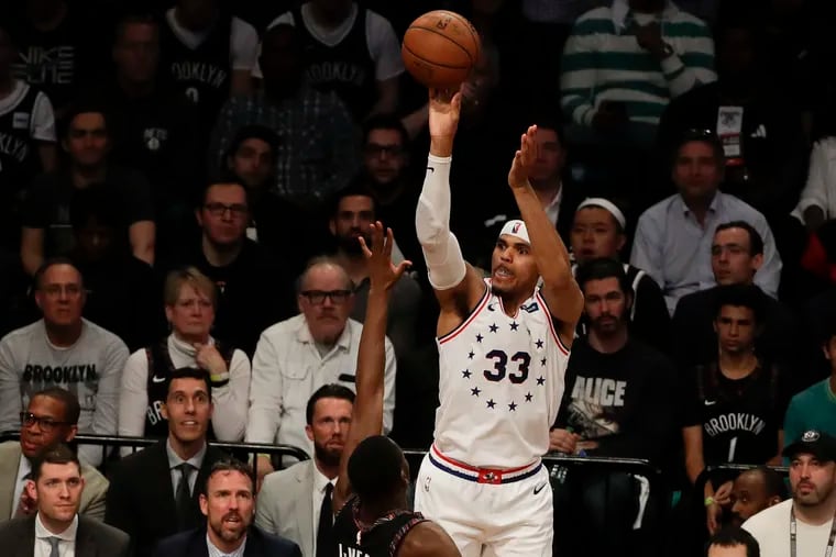 Sixers forward Tobias Harris shoots the basketball over Brooklyn Nets guard Caris LeVert in game three of the Eastern Conference playoffs on Thursday, April 18, 2019 in Brooklyn.