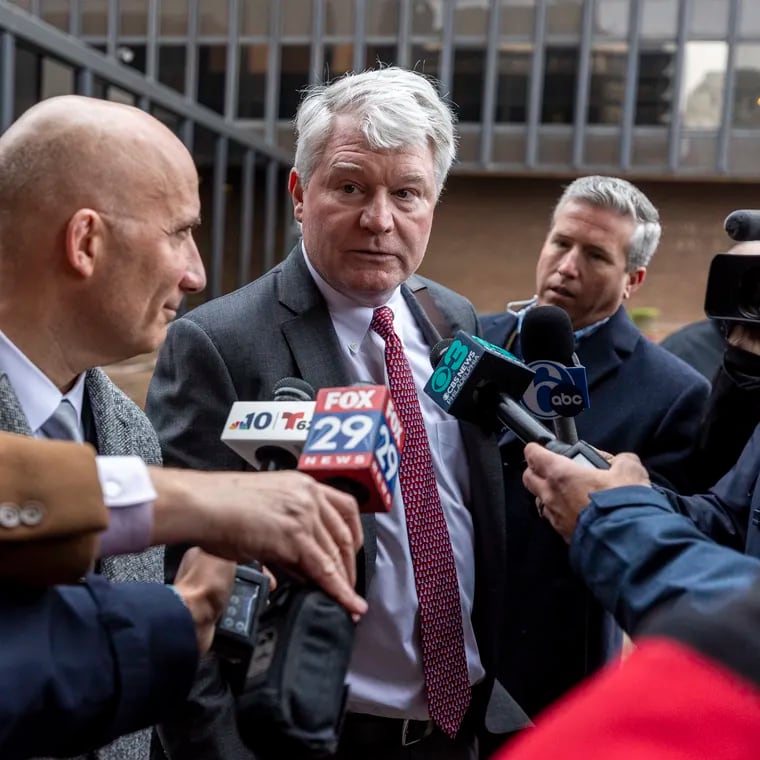John Dougherty and defense lawyer Gregory J. Pagano speak with reporters outside the federal courthouse in Philadelphia in December after the former labor leader's conviction on nearly all charges in his union embezzlement trial.