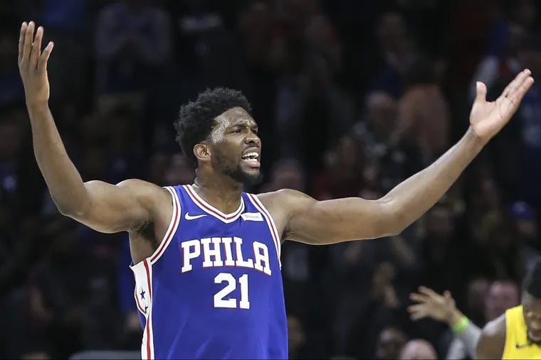 Sixers' Joel Embiid tries to get the fans involved against the Lakers during the 4th quarter at the Wells Fargo Center in Philadelphia, Thursday, December 7, 2017. Lakes beat the Sixers 107-104 STEVEN M. FALK / Staff Photographer