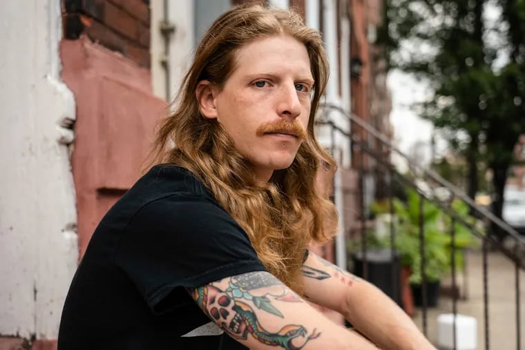 Miles Ziskind, 28, shown here on his South Philly stoop, was a passenger in a car stopped by police in Wall Township, N.J. He was arrested for possession of marijuana.<br/>
 JESSICA GRIFFIN / Staff Photographer