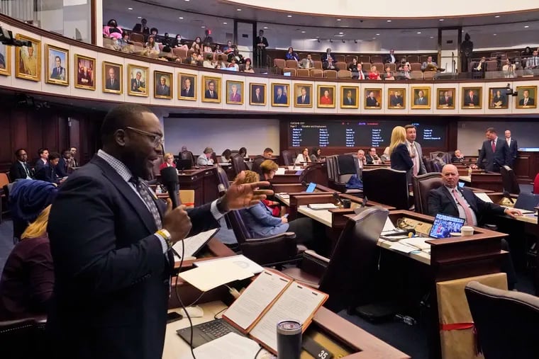 Florida Sen. Shevrin Jones, left, speaks about his proposed amendment to a bill, dubbed by opponents as the "Don't Say Gay" bill, to forbid discussions of sexual orientation and gender identity in schools, during a legislative session at the Florida State Capitol, Monday, March 7, 2022, in Tallahassee, Fla.