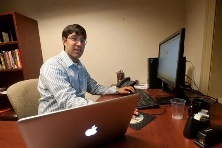 Nick Kapur is a history professor who depends on Internet access for his research and teaching. He finds the cyber attacks disruptive. (AVI STEINHARDT/ For The Inquirer)