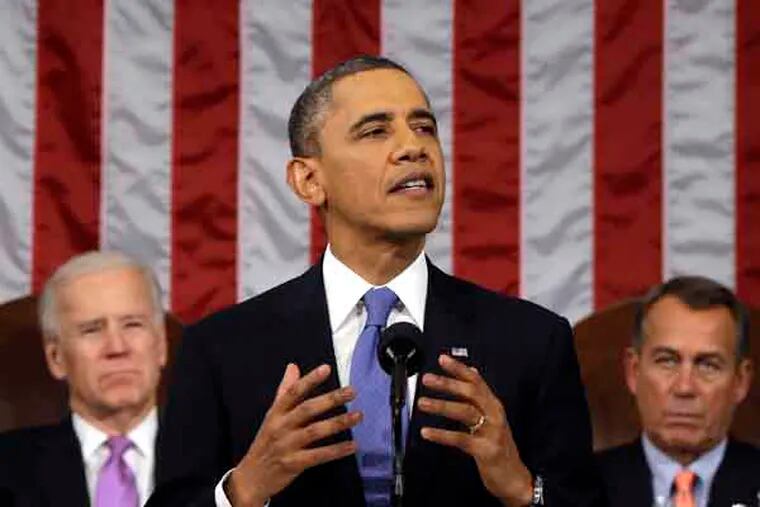 President Barack Obama, flanked by Vice President Joe Biden and House Speaker John Boehner of Ohio, gestures as State of the Union address during a jointhe gives his session of Congress on Capitol Hill in Washington, Tuesday Feb. 12, 2013. (AP Photo/Charles Dharapak, Pool)