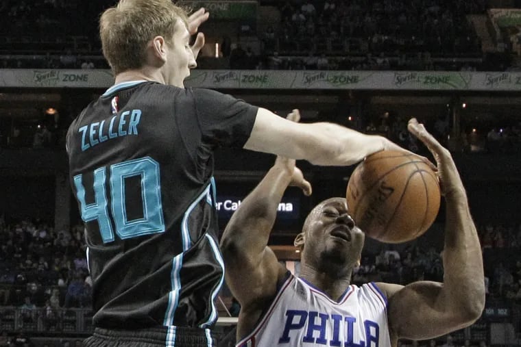 Hornets' Cody Zeller blocks a shot by 76ers' Carl Landry during the first half Friday night.