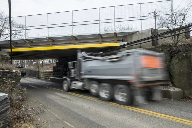 A truck passes under the Flourtown Road Railroad Bridge in Plymouth Meeting, PA. Two Conshohocken women were killed when a concrete truck slammed into this bridge and crushed the women's car. A few years ago, when officials raised the height of the bridge. MICHAEL BRYANT / Staff Photographer