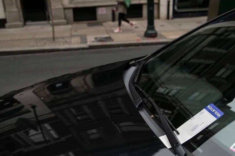 A parking ticket sits on a vehicle parked along Walnut between 15th and 16th streets in Center City Philadelphia.