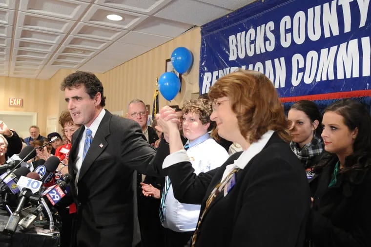 In 2012, Congressman Mike Fitzpatrick raises his wife Kathy's hand in triumph after winning re-election.