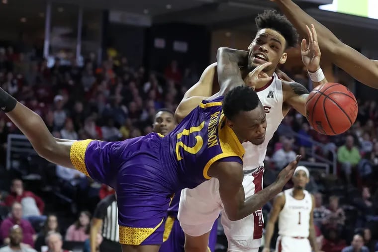 Arashma Parks, right, of Temple gets fouled by Tremont Robinson-White of East Carolina during the 2nd half at the Liacouras Center on Feb. 1, 2020.  It was ruled a flagrant foul.