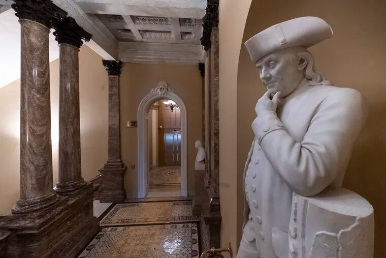 A statue of Benjamin Franklin is seen in an empty corridor outside the Senate at the Capitol in Washington, Thursday, Dec. 27, 2018, during a partial government shutdown. Chances look slim for ending the partial government shutdown any time soon. Lawmakers are away from Washington for the holidays and have been told they will get 24 hours' notice before having to return for a vote. (AP Photo/J. Scott Applewhite)