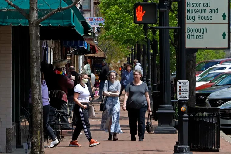 People gather outside shops in Beaver, Pa. Beaver County Commissioners have said they disagree with Gov. Tom Wolf and the county will act as if they are transitioning to the "yellow" phase on May 15.