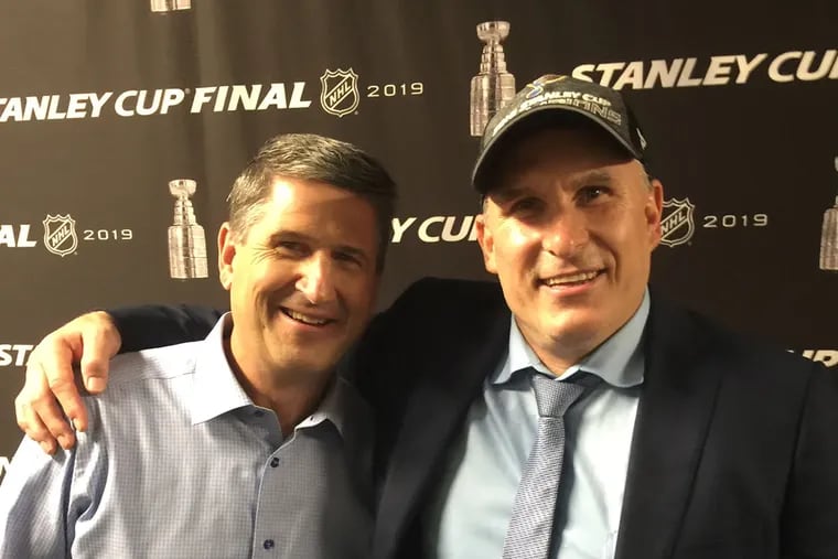 Keith Jones (left) and Craig Berube, after the Blues won the Stanley Cup
