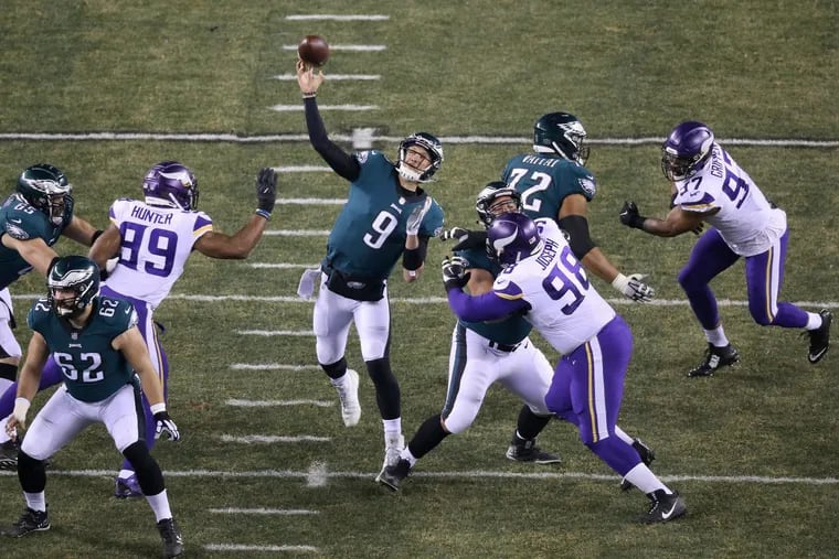 Eagles quarterback Nick Foles (9) throwing a pass during the first half Sunday night.