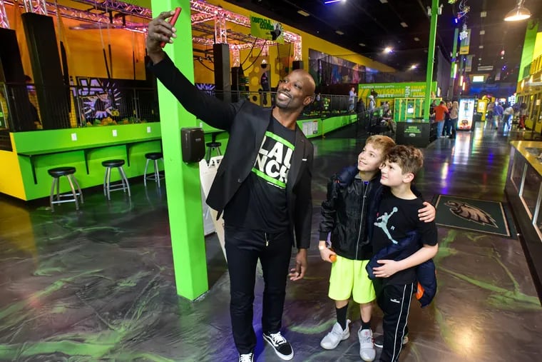 Jason Avant shots a selfie with cousins Eric Leva (left), 11, and Michael Ferraro, 10, from Barrington at his Launch Trampoline Park in Deptford. The former Eagle wide receiver opened the park two years ago and will soon open a second one in Delran, and then later a third in Newark, Del.