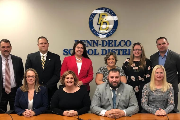 Leon Armour, president of the Penn-Delco School Board (seated, third from left), said his Facebook posts mocking Mexicans and people complaining about police mistreatment "were only meant to be humorous."