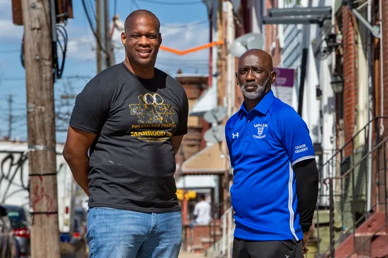 Naim Bellinger (left) and David Chaney Sr. are the co-directors of a mentorship program for young men at Vaux Big Picture High School.