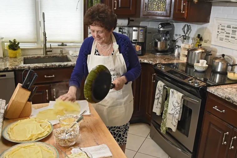 Author Elisa Costantini in her Newtown Square kitchen, making scrippelles. The crepes, popular in her home province of Teramo, are said to date to the French occupation in 1798. She will be at the Italian Market Festival.
