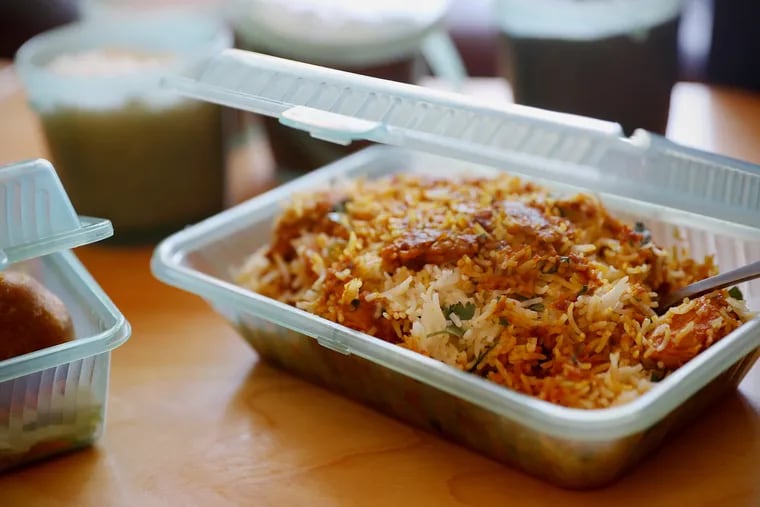 Chicken biryani from Tiffin Indian Cuisine in South Philadelphia in a reusable plastic takeout container.