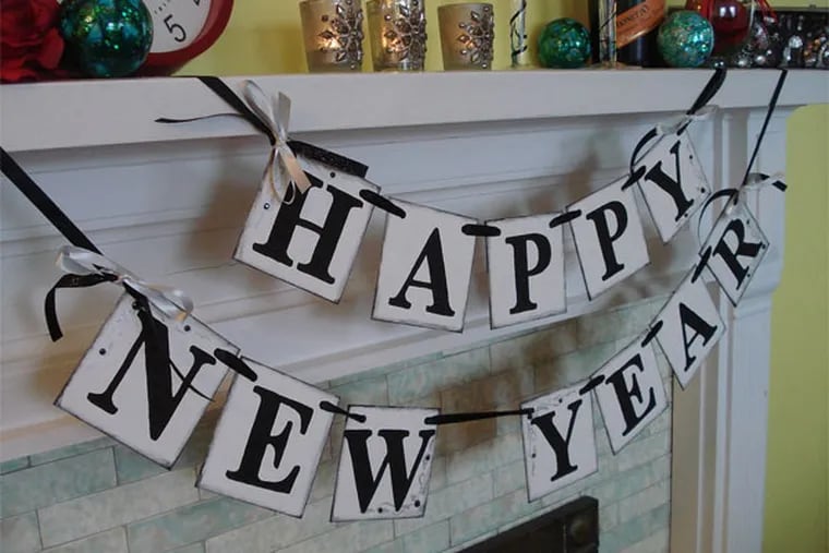 Hosting a New Year's party this year? Let everyone know! The lettering on this banner has been hand-stamped and antiqued for that perfect vintage look.