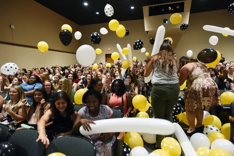 Freshman students at  the Cedar Crest College react to the Convocation announcement the class would take a group excursion to Brazil during their sophomore year on Sunday, Aug. 28, in Allentown.