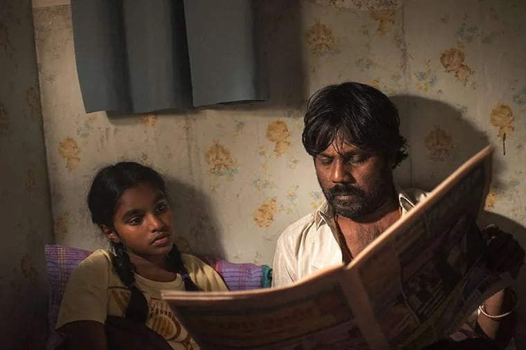 &quot;Dheepan,&quot; about a Tamil Tiger who leaves Sri Lanka and settles in Paris with a makeshift family of refugees, took the first-prize Palme D'Or (the Golden Palm), at the Cannes Film Festival on Sunday.